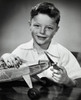 Portrait of boy holding model airplane Poster Print - Item # VARSAL2553264