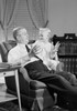 Grandfather and grandson sitting in armchair Poster Print - Item # VARSAL255419107D