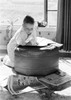 Boy leaning on hassock  reading newspaper Poster Print - Item # VARSAL255416326