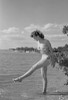 Young woman walking over lake Poster Print - Item # VARSAL255418684