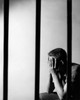 Male prisoner sitting in prison cell Poster Print - Item # VARSAL2557187