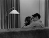 Young couple kissing on sofa  rear view Poster Print - Item # VARSAL255421697