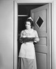 Maid holding a tray and standing at a door Poster Print - Item # VARSAL2552486B