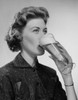 Young woman drinking beer Poster Print