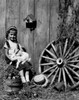 Girl playing with rabbit in rural garden Poster Print - Item # VARSAL25514196