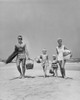 Parents with two children walking on beach Poster Print - Item # VARSAL2553164