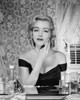 Young woman applying make-up to face Poster Print - Item # VARSAL25526034A