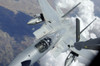 An F-15 Eagle pulls away from a KC-135 Stratotanker after refueling Poster Print