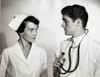 Doctor and a female nurse looking at each other Poster Print - Item # VARSAL25523306 Doctor and a female nurse looking at each other Poster Print - Item # VARSAL25523306