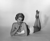 Young woman lying down and wearing bikini  studio shot Poster Print - Item # VARSAL255417356