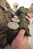 A Marine cradles handfuls of 40 mm grenades during a training exercise at Camp Fallujah's Eagle Range. Poster Print - Item # VARPSTSTK101830M