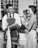 Young couple washing dishes in kitchen Poster Print - Item # VARSAL25537589