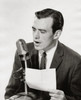 Mid adult man speaking into a microphone Poster Print - Item # VARSAL2553064