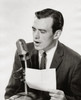 Mid adult man speaking into a microphone Poster Print - Item # VARSAL2553064