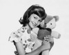 Portrait of a girl holding a teddy bear and smiling Poster Print - Item # VARSAL25513909