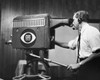 Side profile of a cameraman operating a television camera Poster Print - Item # VARSAL2557824B