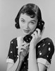 Studio portrait of young woman talking on phone Poster Print - Item # VARSAL255422855