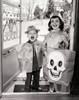 Portrait of a boy and a girl wearing Halloween costumes for trick or treating Poster Print - Item # VARSAL25536514