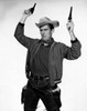 Cowboy holding two pistols Poster Print - Item # VARSAL2557172