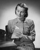 Young woman writing on a notepad Poster Print - Item # VARSAL2553078
