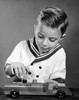 Boy playing with a toy truck Poster Print - Item # VARSAL25513067A
