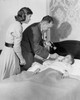 Side profile of a male pediatrician examining a boy's throat Poster Print - Item # VARSAL25515180
