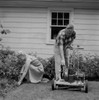 Senior couple mowing grass in backyard Poster Print - Item # VARSAL255417543