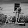 Senior couple mowing grass in backyard Poster Print - Item # VARSAL255417543