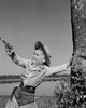 Boy dressed as cowboy playing with toy gun Poster Print - Item # VARSAL255422749