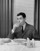 Mid adult man drinking juice Poster Print - Item # VARSAL25512692 Mid adult man drinking juice Poster Print - Item # VARSAL25512692
