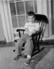 Boy sitting in rocking chair Poster Print - Item # VARSAL255423341