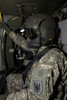 UH-60 Black Hawk crew chief enjoys the ride to Playas Training Area, New Mexico, during exercise Angel Thunder 2013 Poster Print - Item # VARPSTTMO100985M