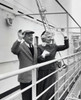 Senior couple standing on the deck of a cruise ship and waving Poster Print - Item # VARSAL2552992B