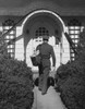 Rear view of a postman delivering mail Poster Print - Item # VARSAL25528925