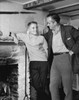 Father standing with his son near a fireplace Poster Print - Item # VARSAL25519629