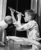 Boy looking through a telescope Poster Print - Item # VARSAL2555266