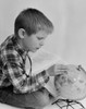 Boy looking at globe Poster Print - Item # VARSAL255416443