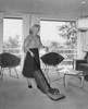 Mid adult woman vacuuming Poster Print - Item # VARSAL25519096
