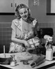 Young woman preparing cookies in the kitchen Poster Print - Item # VARSAL25527691