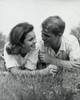 Close-up view of young couple lying in park Poster Print - Item # VARSAL25526849B