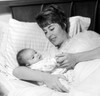 Mother lying in bed with newborn baby Poster Print - Item # VARSAL2559879