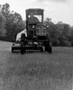 Farmer driving a tractor in a field Poster Print - Item # VARSAL2554206