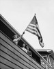 Low angle view of a boy holding an American flag  USA Poster Print - Item # VARSAL25513749