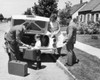 Parents and their children loading luggage into a car Poster Print - Item # VARSAL25517862