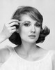 Portrait of a young woman applying eyeliner to her eyes Poster Print - Item # VARSAL2556048B