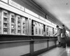 Side profile of two men standing at the counter of a restaurant Poster Print - Item # VARSAL25538118