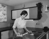 Young woman cleaning a kitchen counter Poster Print - Item # VARSAL25541748