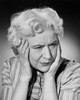 Close-up of a senior woman suffering from a headache Poster Print - Item # VARSAL25533119