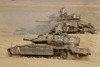A pair of Israel Defense Force Merkava Mark IV main battle tanks during an exercise in the Negev desert. Attached to the upper tank is a mine clearing device Poster Print - Item # VARPSTZDN100116M