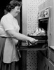 Woman preparing turkey Poster Print
